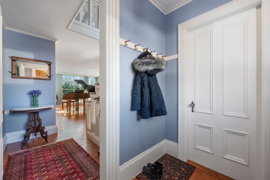 2 South Hampton Road Amesbury, MA 01913 - Photo 5 of 32 a hallway with a table and a couch