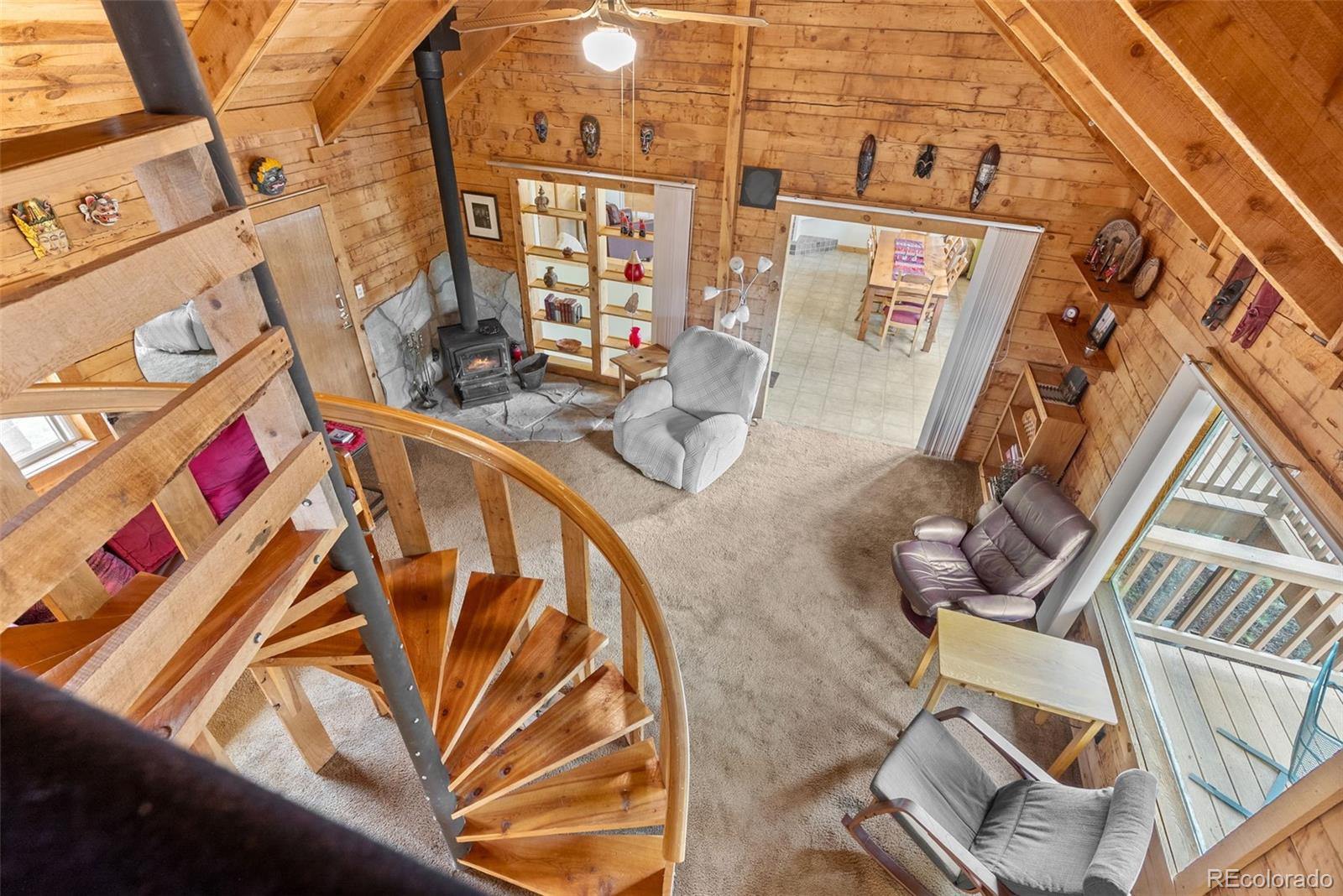 62 Quartz Circle Bailey, CO 80421 - Photo 16 of 38 a view of an chairs and tables in the balcony