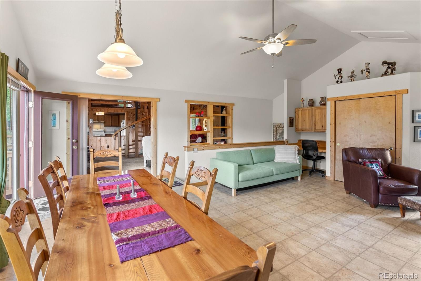 62 Quartz Circle Bailey, CO 80421 - Photo 20 of 38 a living room with furniture a chandelier fan and a window