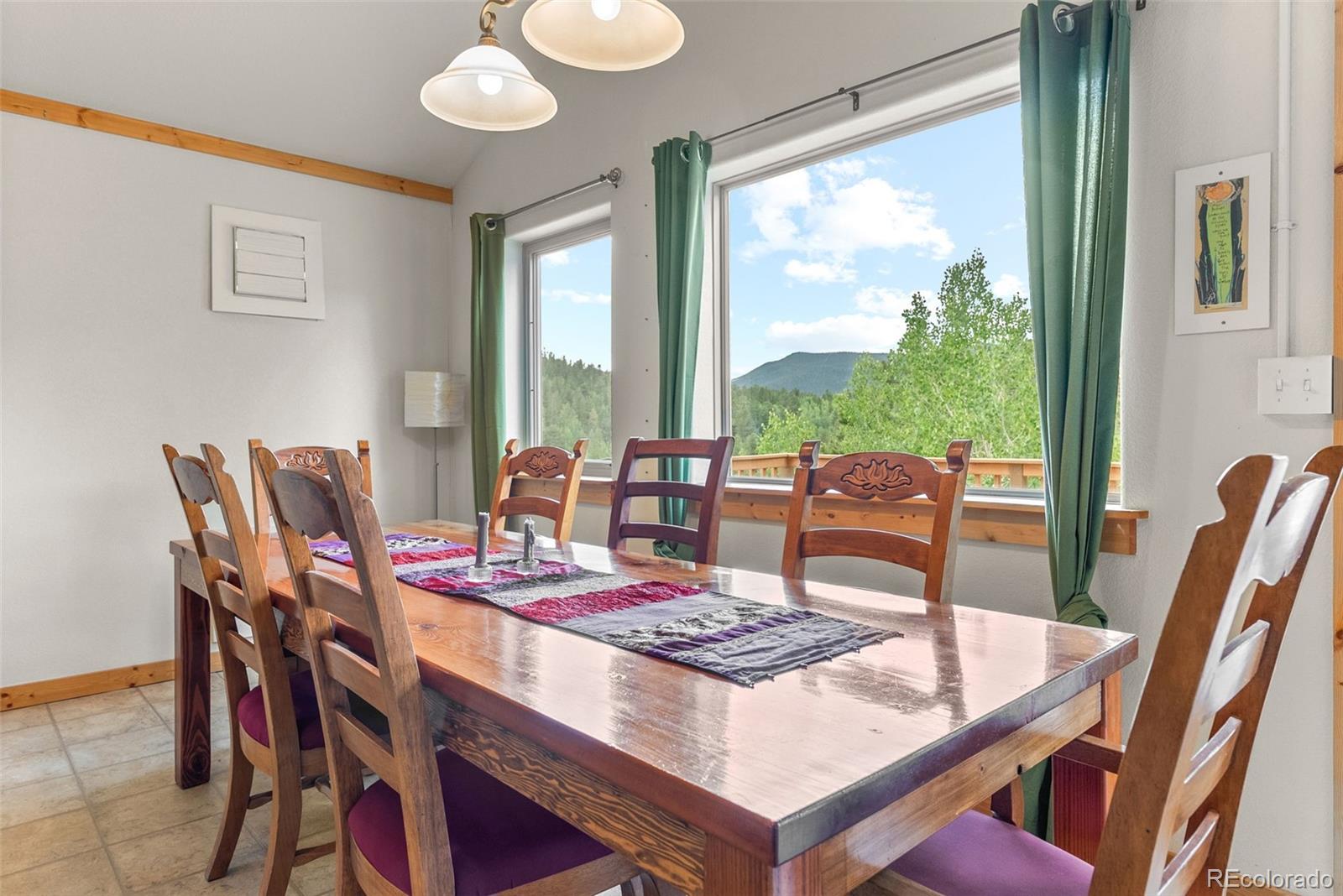 62 Quartz Circle Bailey, CO 80421 - Photo 21 of 38 a view of a dining room with furniture window and outside view