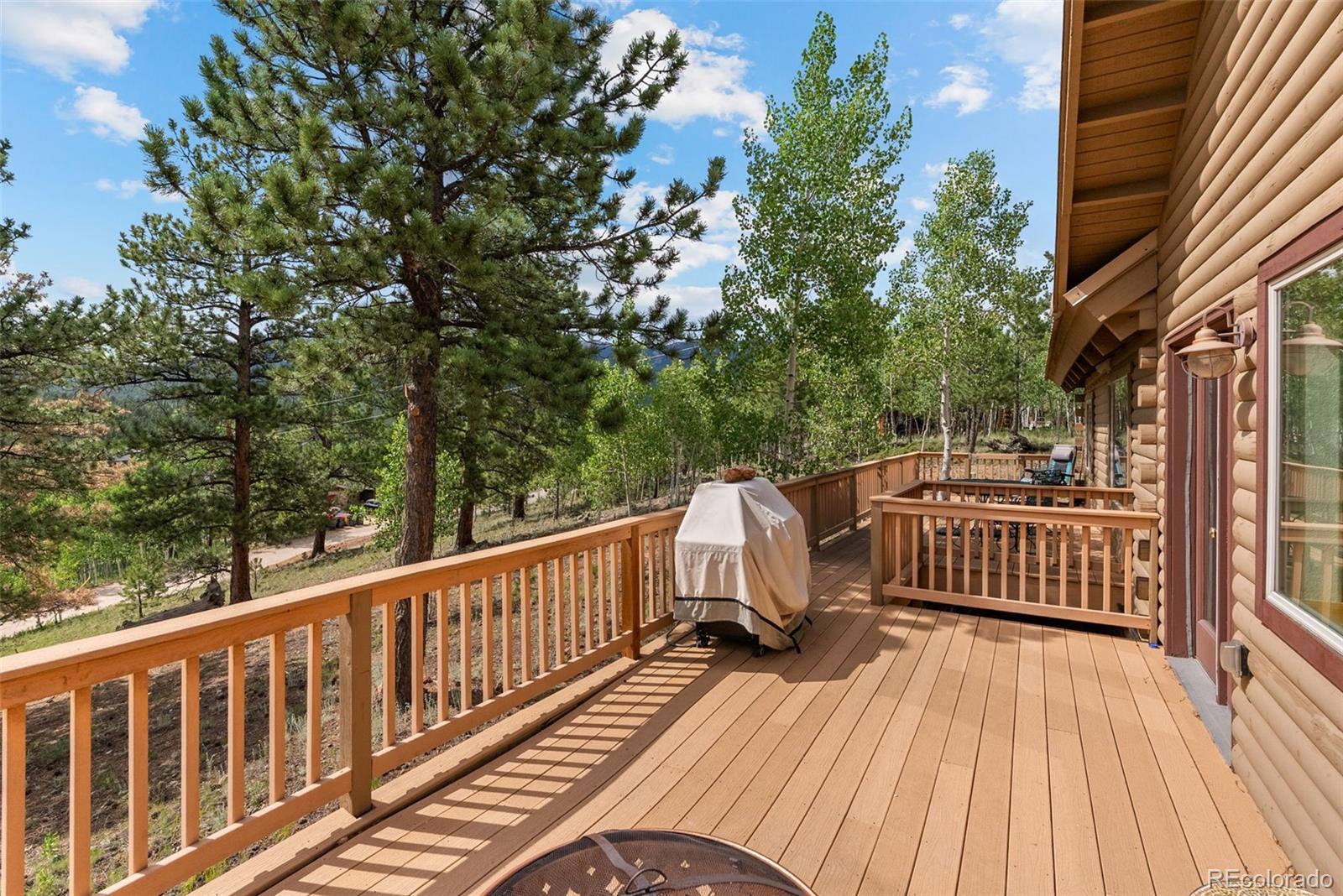 62 Quartz Circle Bailey, CO 80421 - Photo 24 of 38 a view of balcony with wooden floor and fence