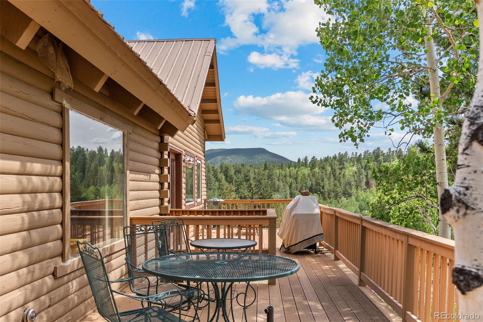 62 Quartz Circle Bailey, CO 80421 - Photo 25 of 38 a view of a chair and table in the balcony