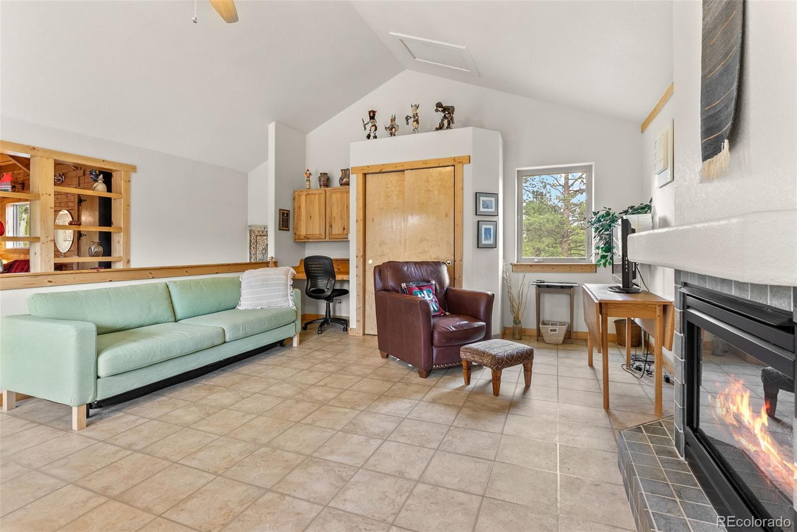 62 Quartz Circle Bailey, CO 80421 - Photo 29 of 38 a living room with furniture and a fireplace