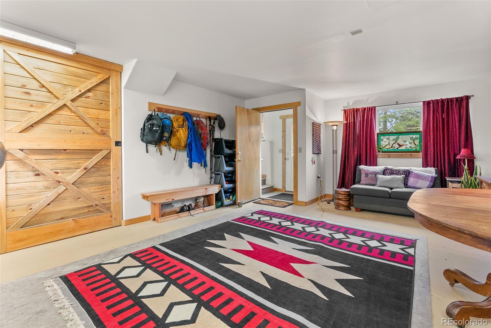 62 Quartz Circle Bailey, CO 80421 - Photo 30 of 38 a living room with furniture and a wall painting