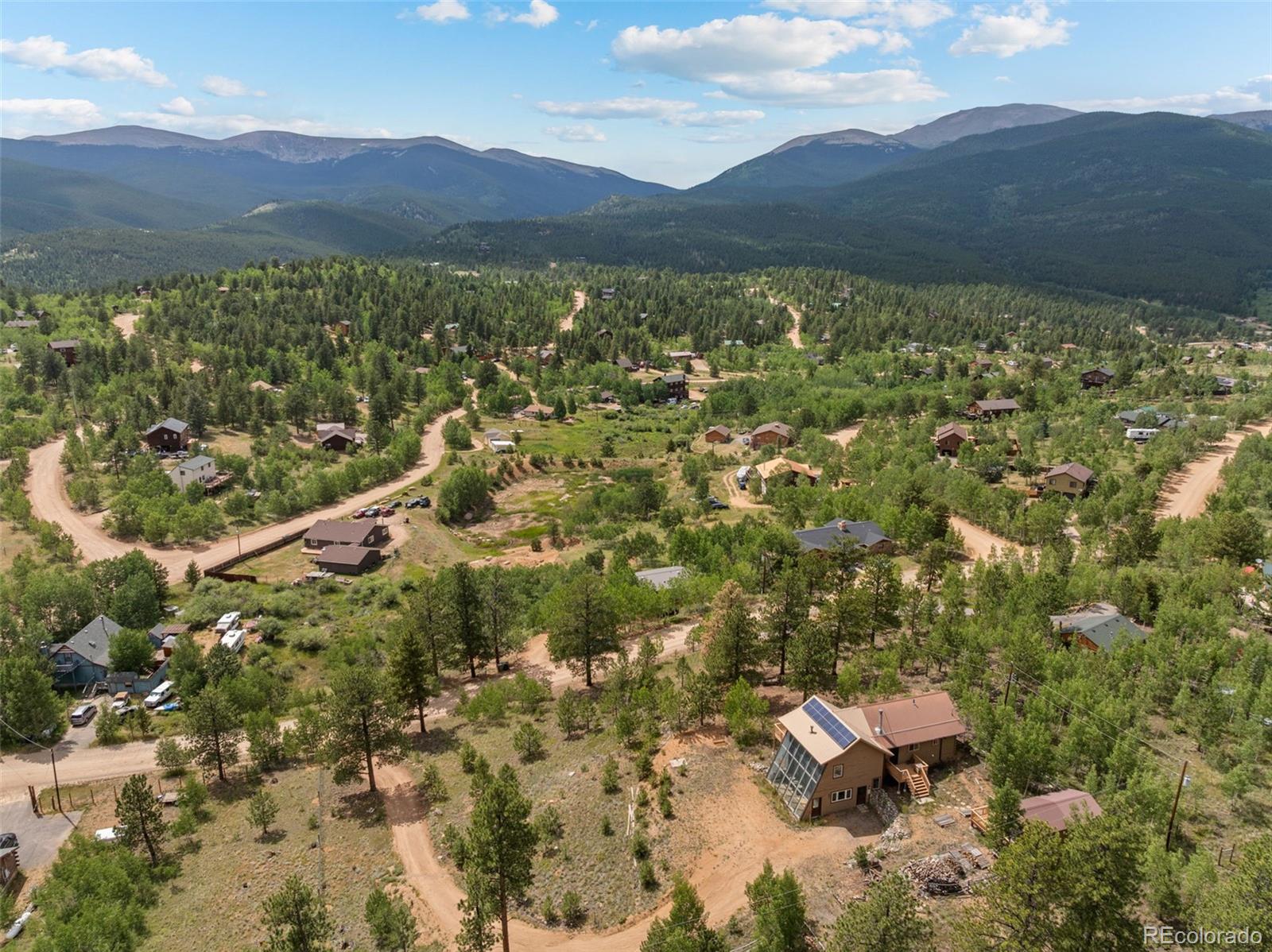 62 Quartz Circle Bailey, CO 80421 - Photo 35 of 38 a view of a lush green hillside and houses