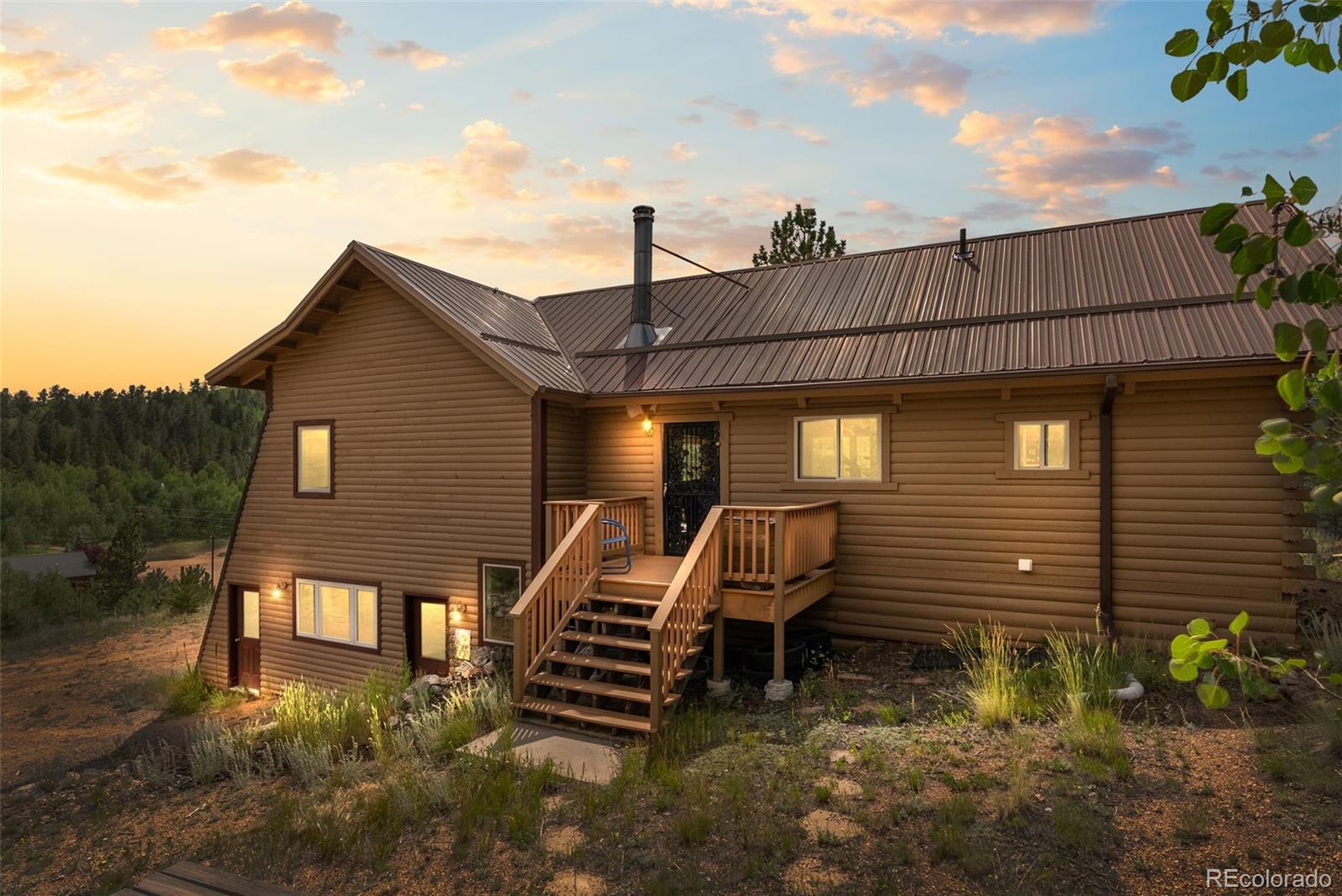 62 Quartz Circle Bailey, CO 80421 - Photo 38 of 38 a front view of a house with a yard