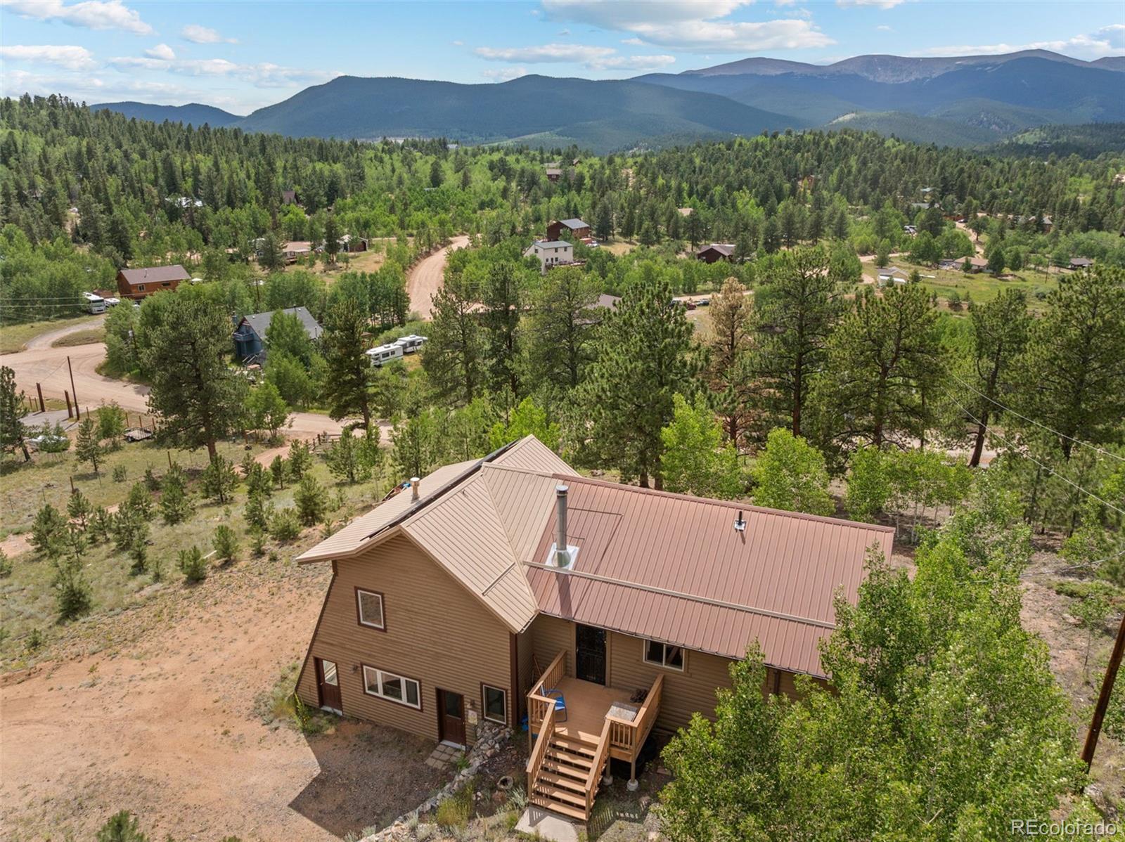 62 Quartz Circle Bailey, CO 80421 - Photo 4 of 38 an aerial view of a house with a mountain