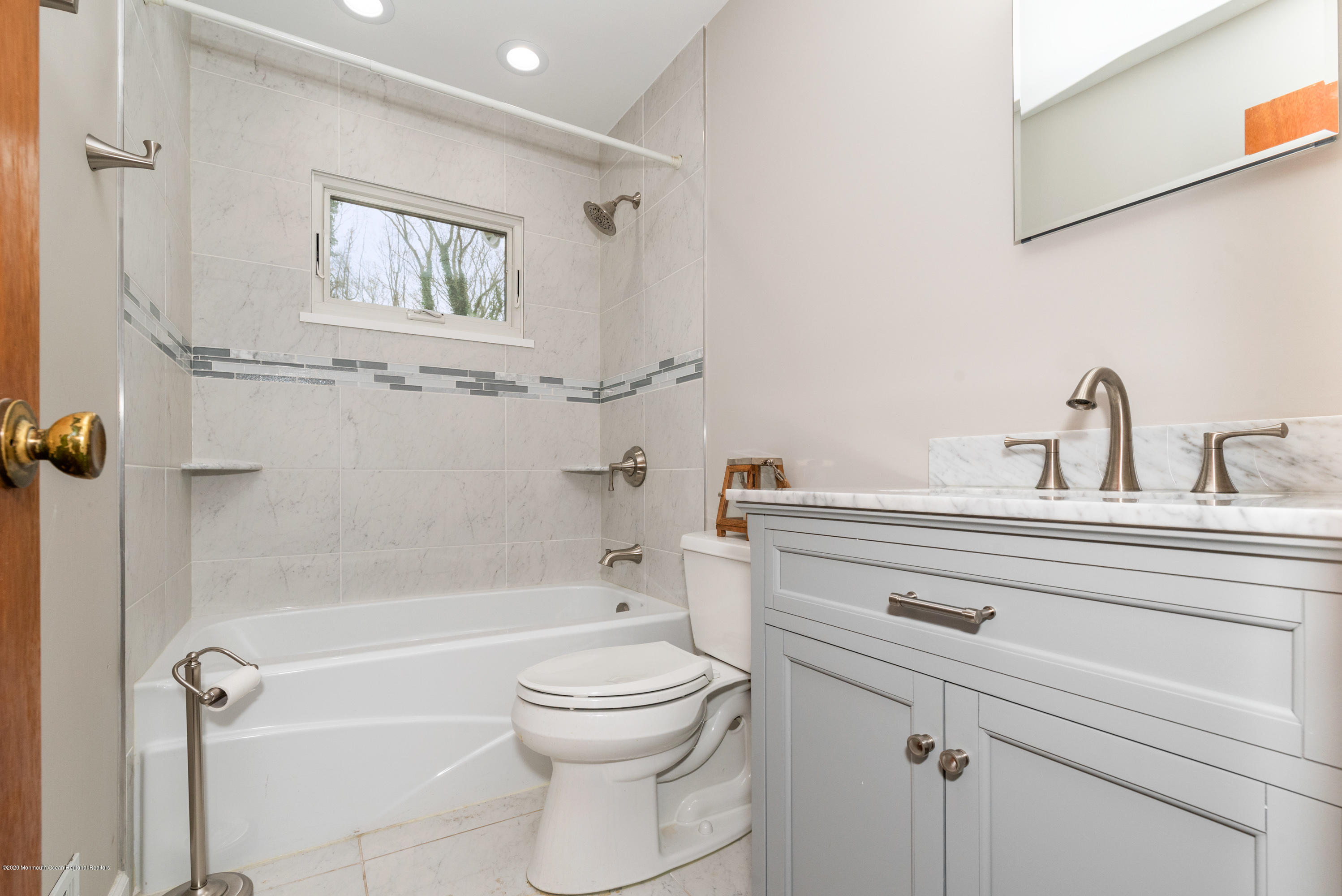 1313 Allaire Road Spring Lake, NJ 07762 - Photo 13 of 23 a bathroom with a sink a toilet and shower