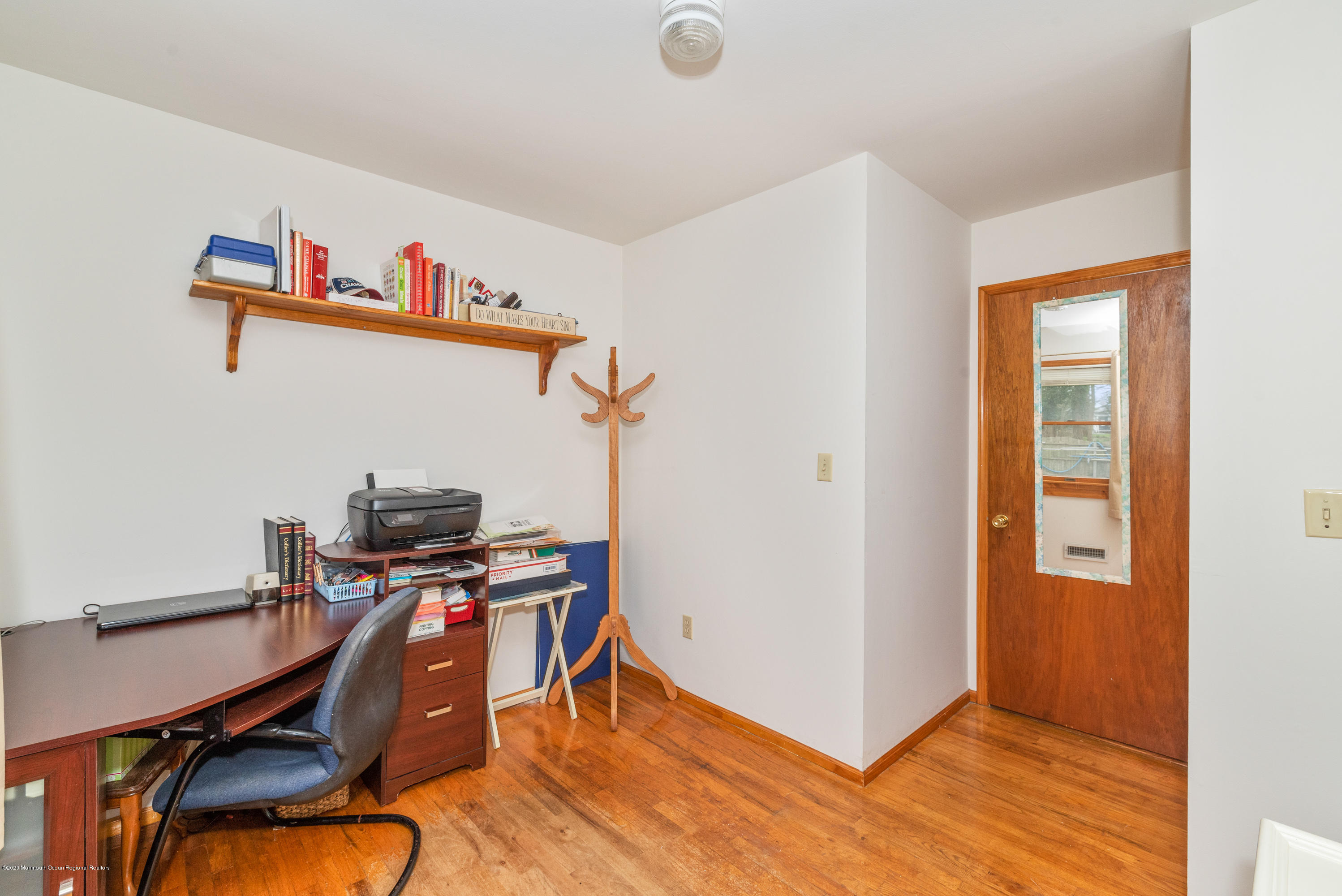 1313 Allaire Road Spring Lake, NJ 07762 - Photo 15 of 23 a view of a workspace with furniture and wooden floor