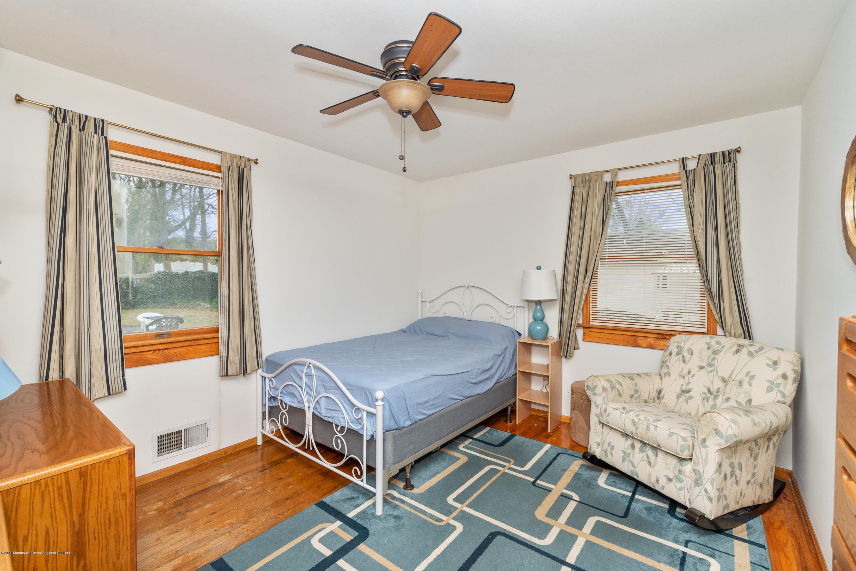 1313 Allaire Road Spring Lake, NJ 07762 - Photo 16 of 23 a living room with a bed furniture and a window