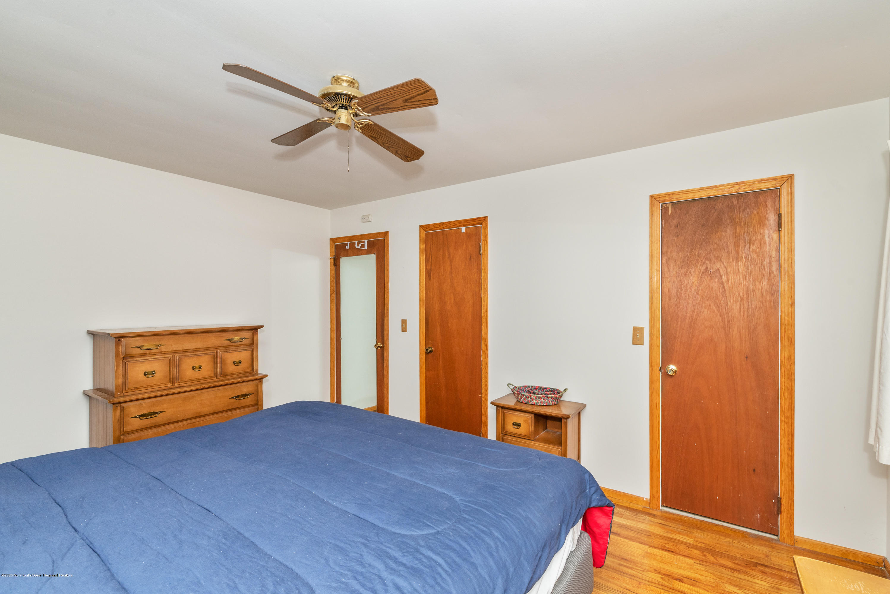 1313 Allaire Road Spring Lake, NJ 07762 - Photo 18 of 23 a bedroom with a bed and a dresser