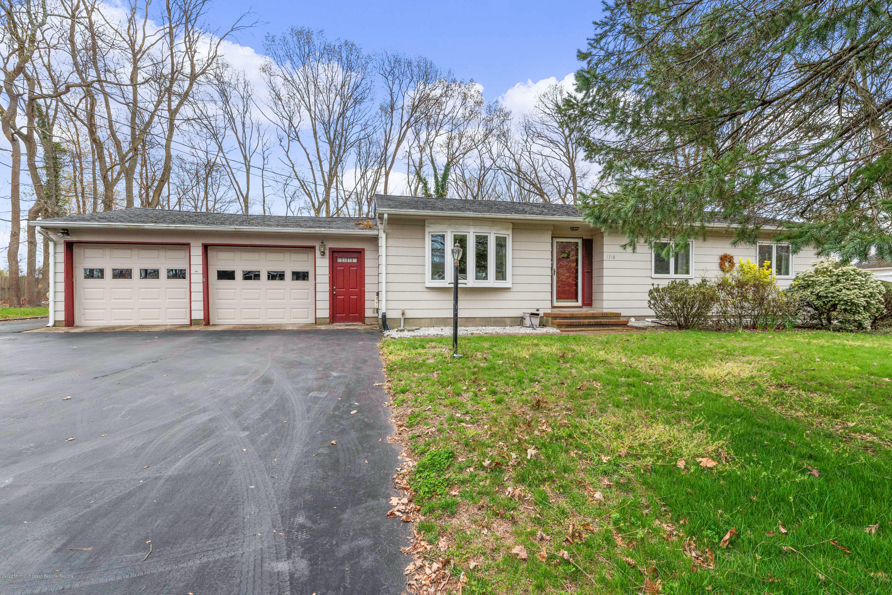 1313 Allaire Road Spring Lake, NJ 07762 - Photo 2 of 23 a front view of house with yard and green space