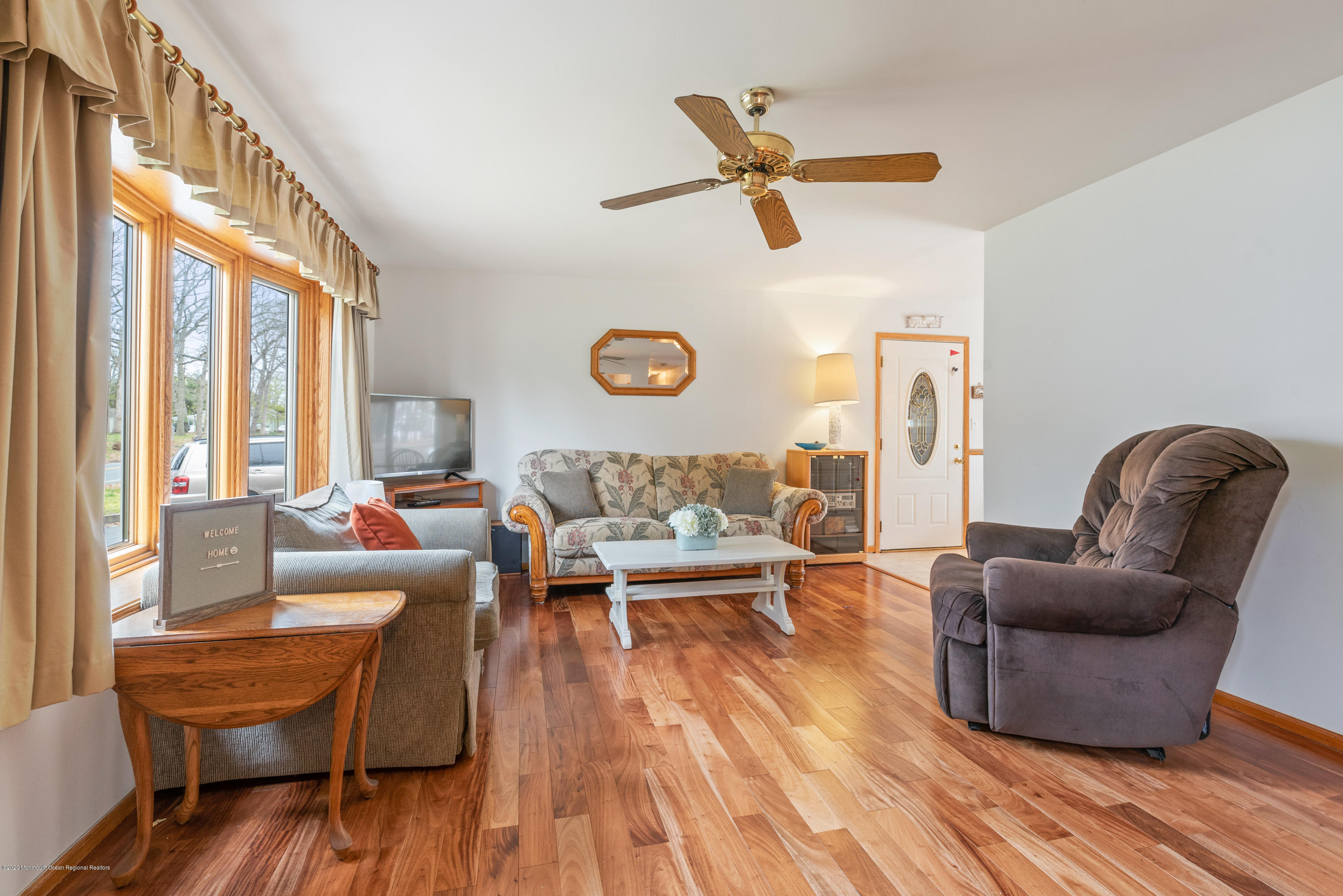 1313 Allaire Road Spring Lake, NJ 07762 - Photo 4 of 23 a living room with furniture and a wooden floor