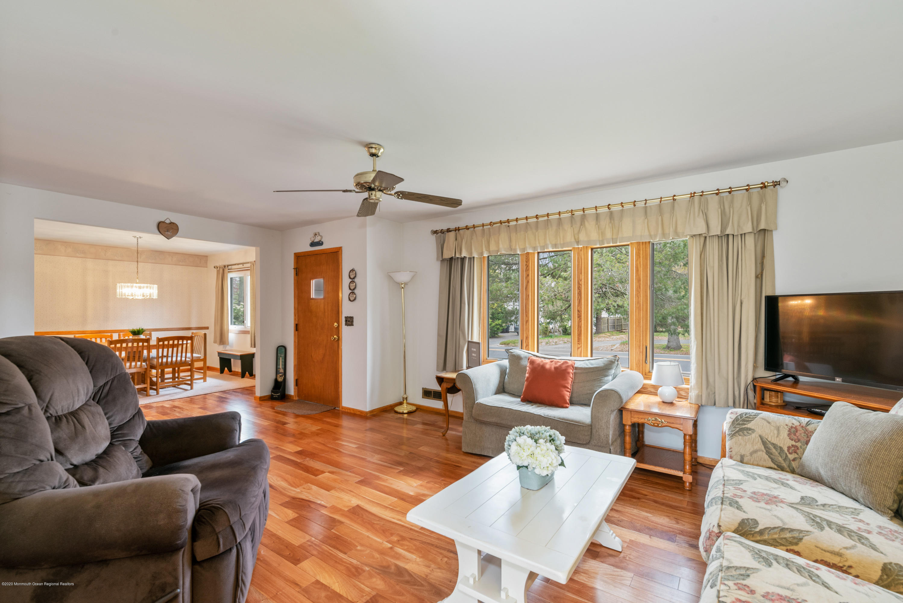 1313 Allaire Road Spring Lake, NJ 07762 - Photo 5 of 23 a living room with furniture and a flat screen tv