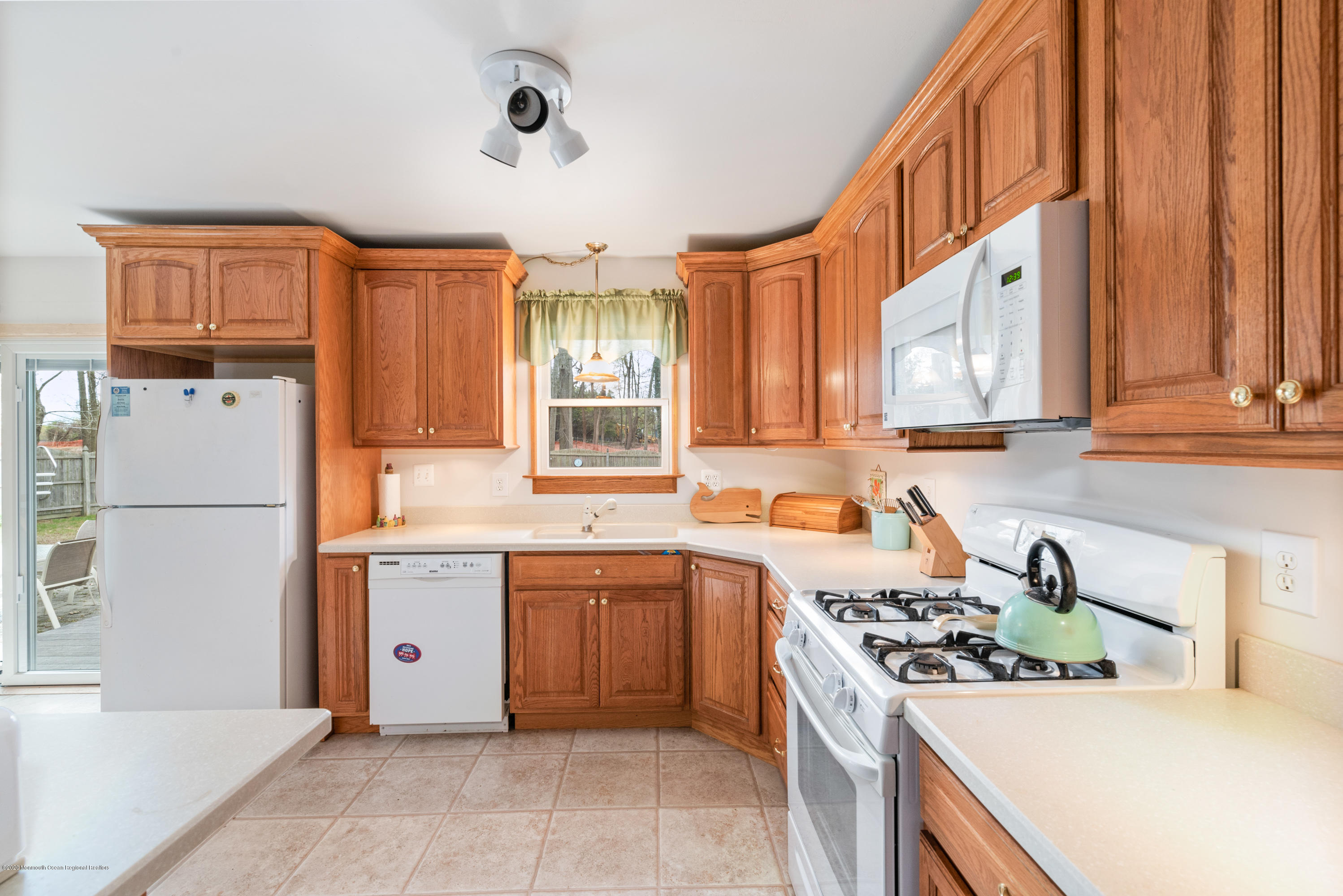 1313 Allaire Road Spring Lake, NJ 07762 - Photo 8 of 23 a kitchen with a sink a stove and cabinets