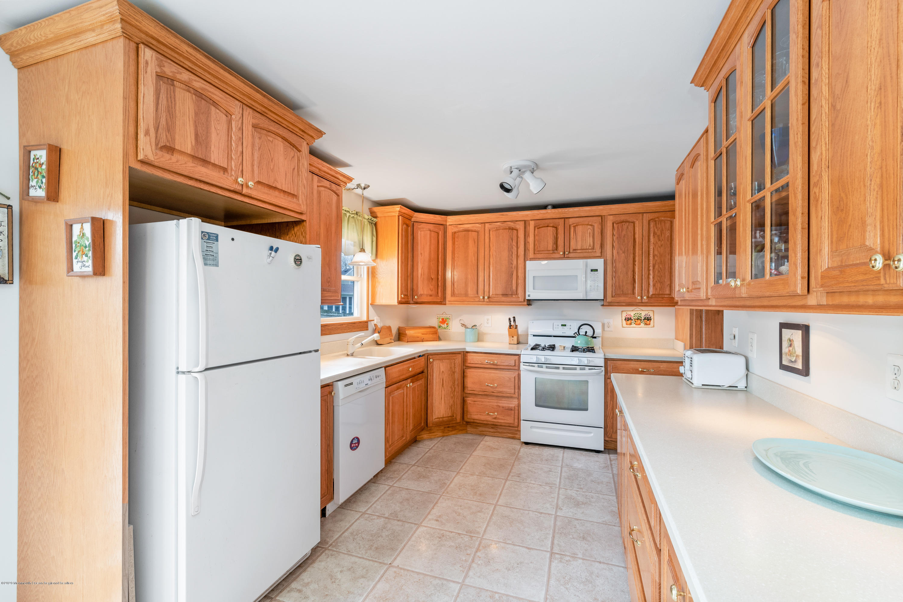 1313 Allaire Road Spring Lake, NJ 07762 - Photo 9 of 23 a kitchen with stainless steel appliances granite countertop a refrigerator sink and stove