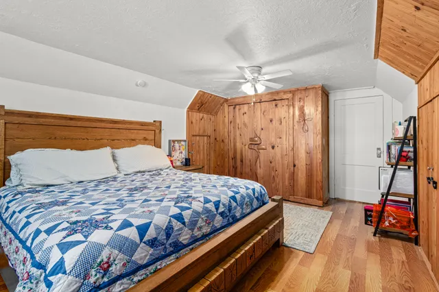 a bedroom with a bed and a walk in closet