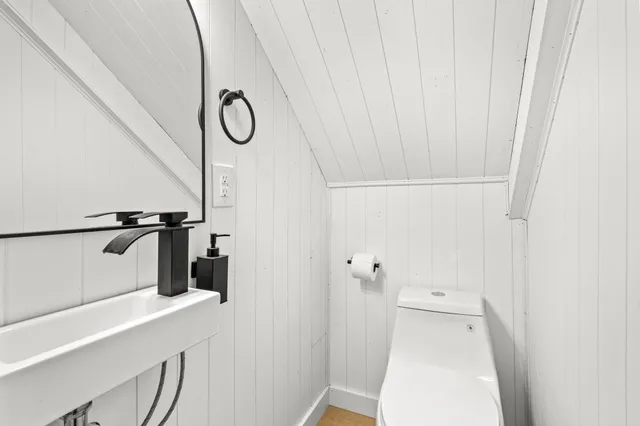 a bathroom with a shower and a sink