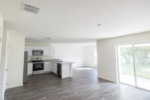 a kitchen with a sink and stainless steel appliances