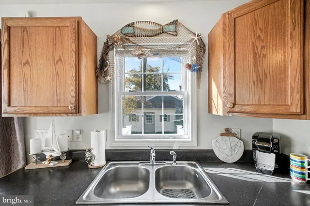 a bathroom with a sink and a window