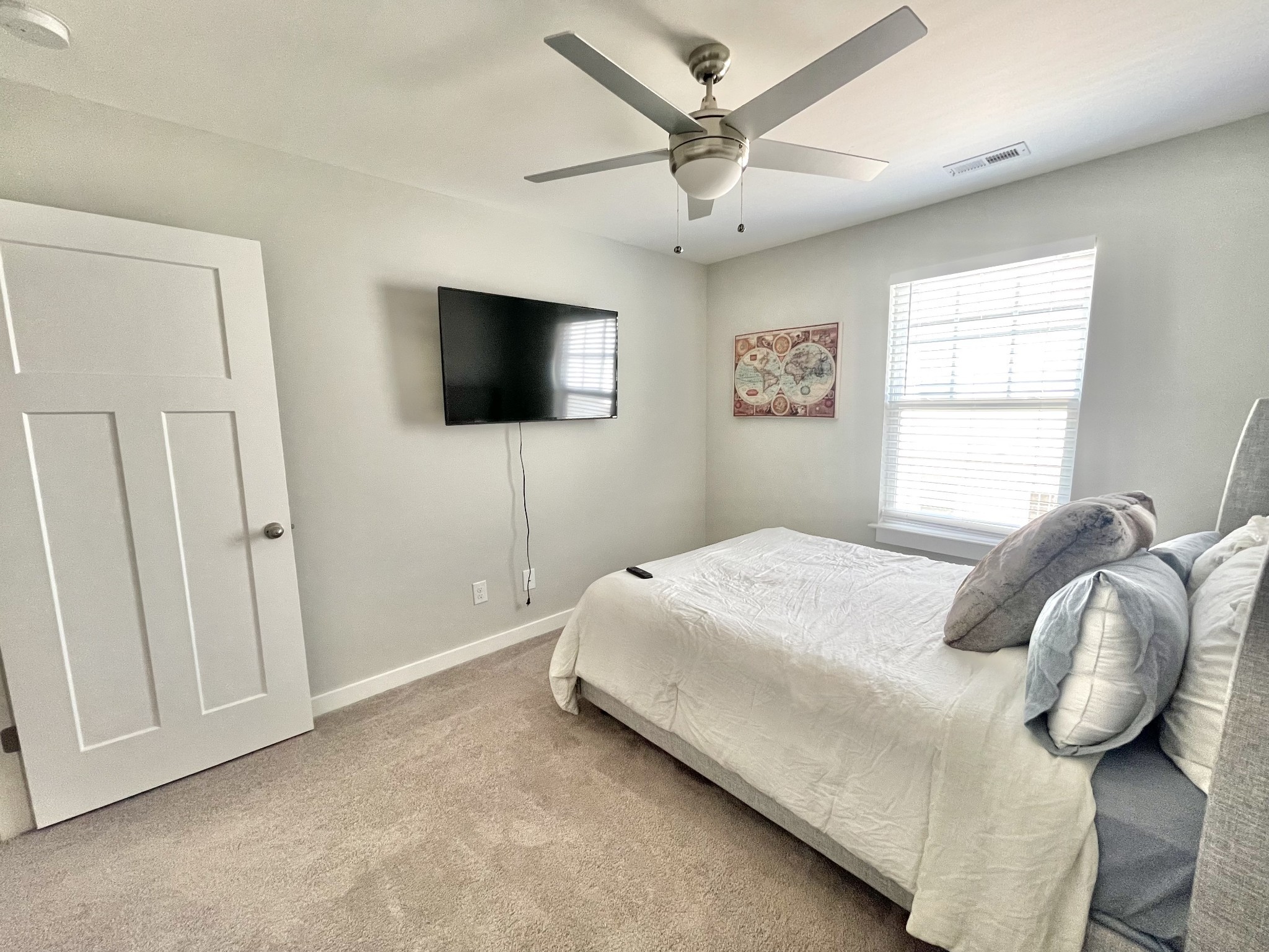 2327 Patrick Avenue Old Hickory, TN 37138 - Photo 23 of 36 a bedroom with a bed and a flat screen tv