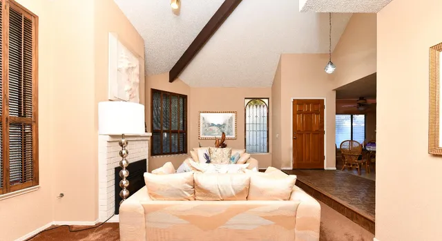 a living room with furniture and a large window