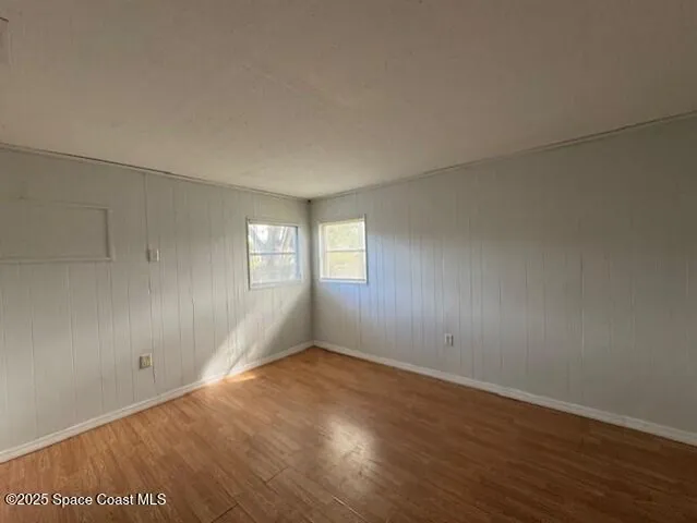 a white toilet sitting next to a bath tub