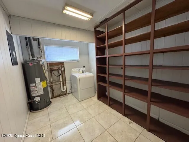 an empty room with wooden floor ceiling fan and windows