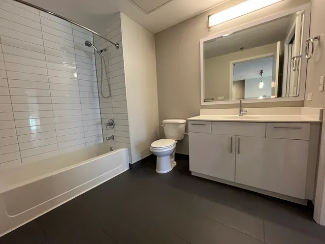 a bathroom with a sink toilet and a bathtub