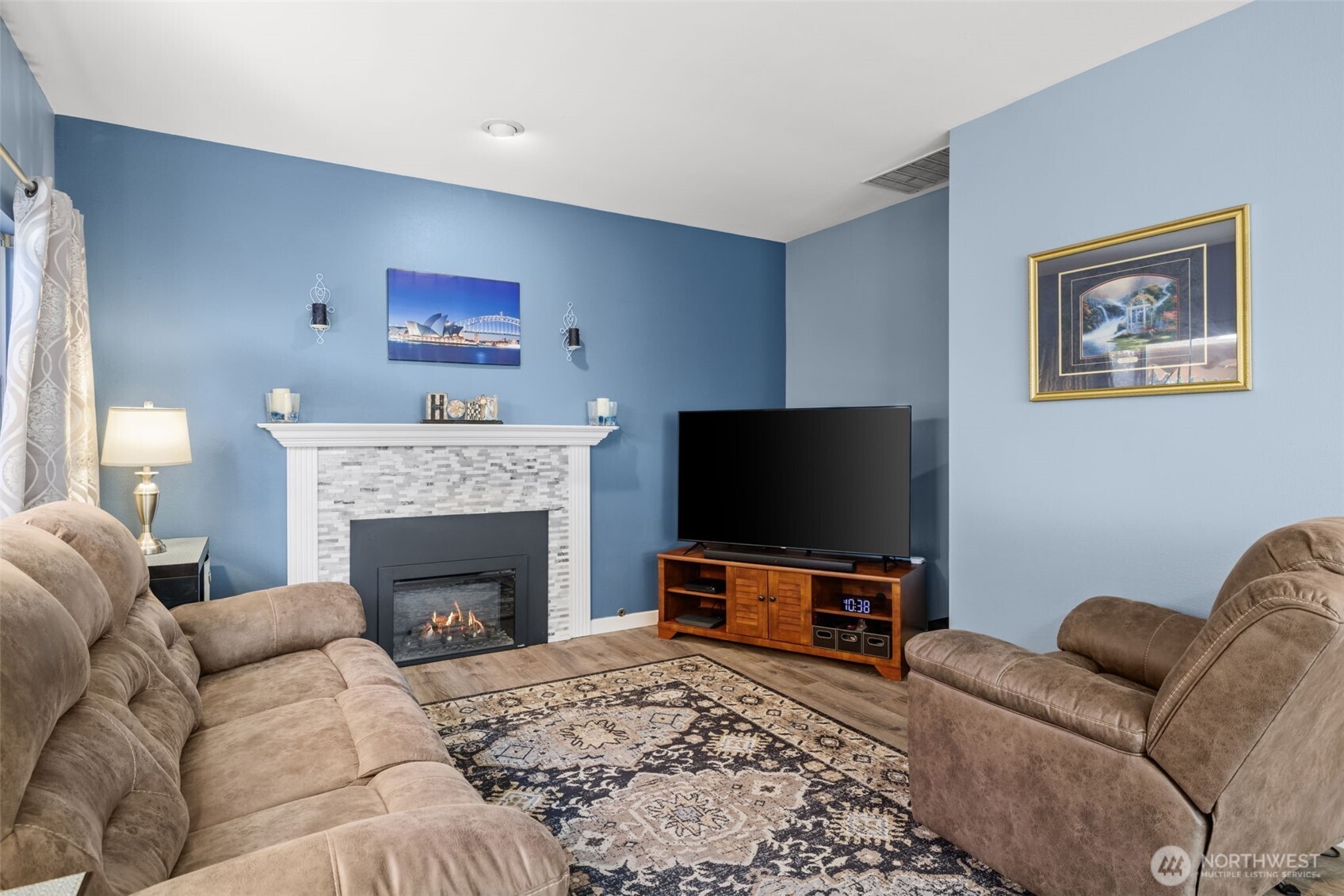 5021 South 232nd Street, Unit 75 Kent, WA 98032 - Photo 14 of 40 a living room with furniture flat screen tv and a fireplace