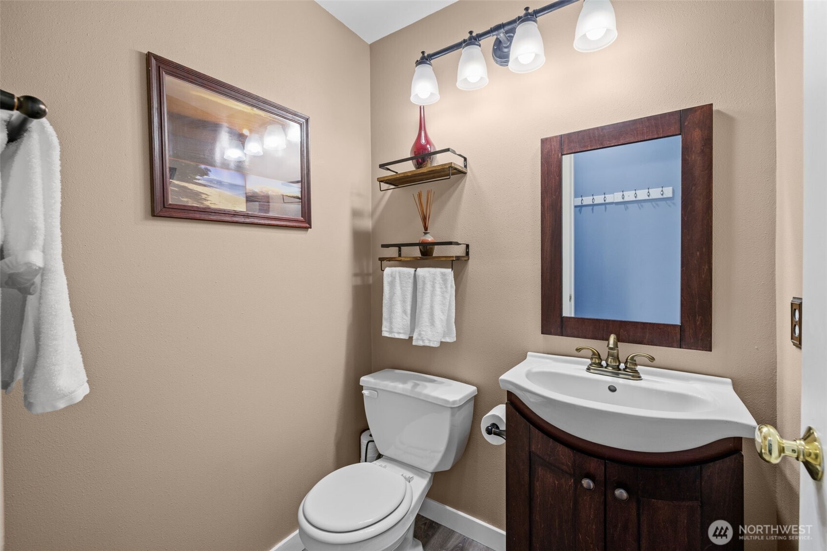 5021 South 232nd Street, Unit 75 Kent, WA 98032 - Photo 16 of 40 a bathroom with a toilet a sink and mirror