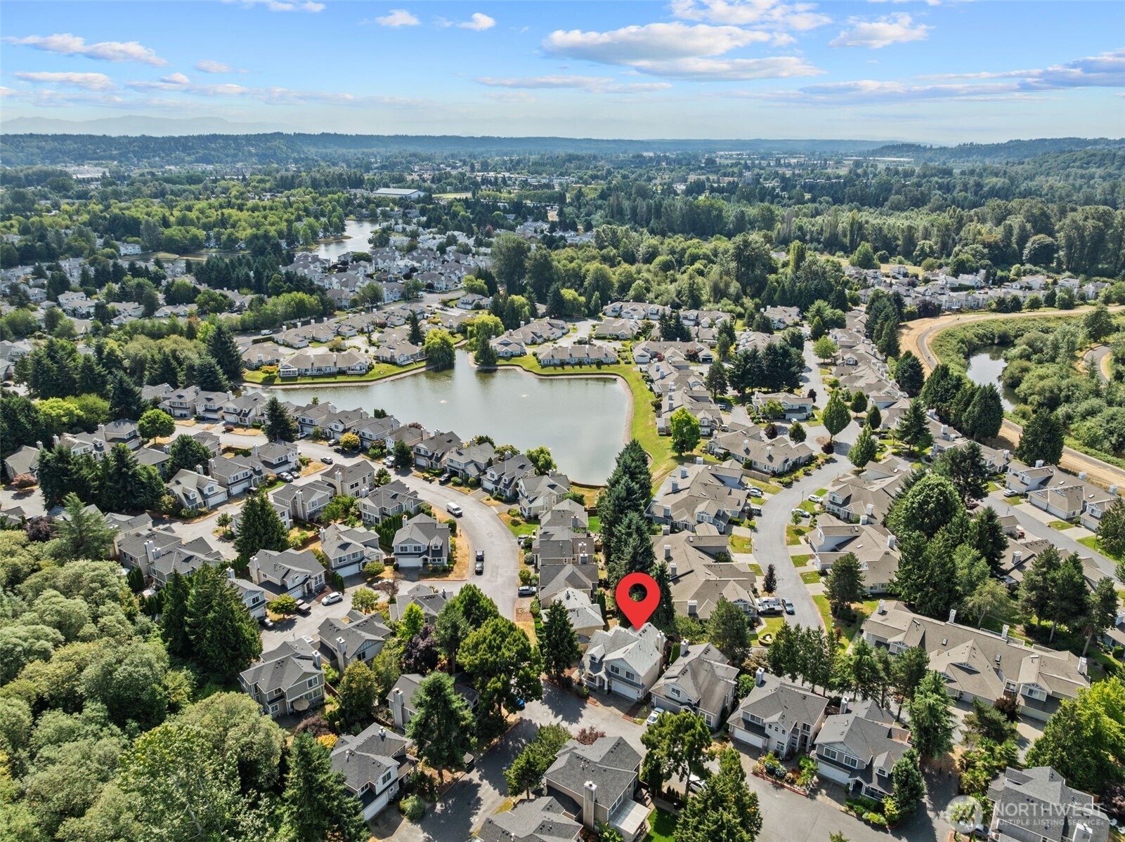 5021 South 232nd Street, Unit 75 Kent, WA 98032 - Photo 37 of 40 an aerial view of a houses with a lake