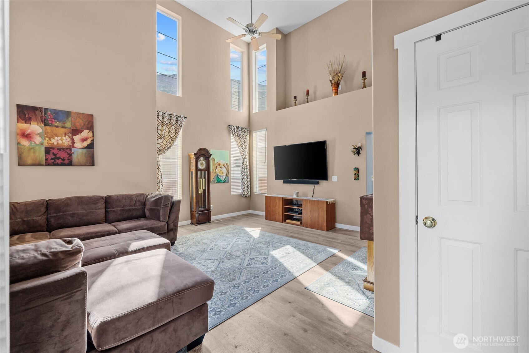 5021 South 232nd Street, Unit 75 Kent, WA 98032 - Photo 4 of 40 a living room with furniture and a flat screen tv