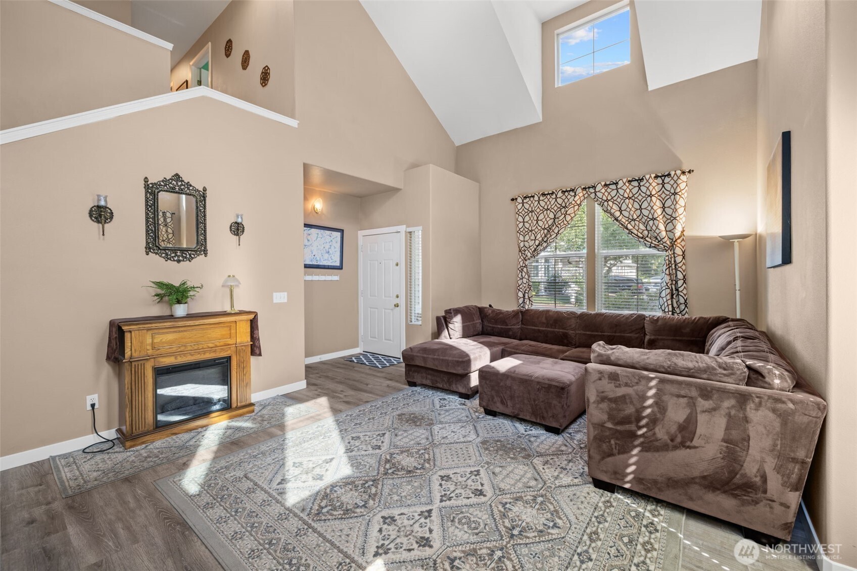 5021 South 232nd Street, Unit 75 Kent, WA 98032 - Photo 8 of 40 a living room with furniture and a fireplace