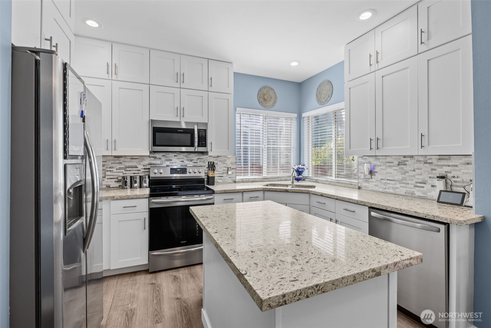 5021 South 232nd Street, Unit 75 Kent, WA 98032 - Photo 9 of 40 a kitchen with granite countertop a stove sink and refrigerator