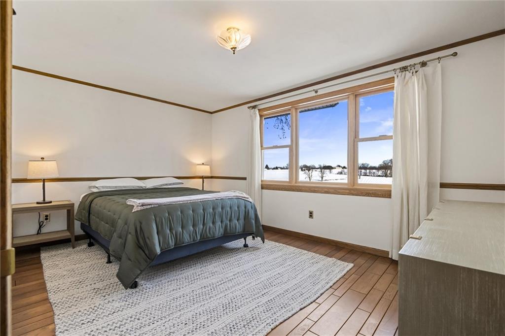 121 Brewer Road Saxonburg, PA 16056 - Photo 23 of 50 a spacious bedroom with a large bed and a window