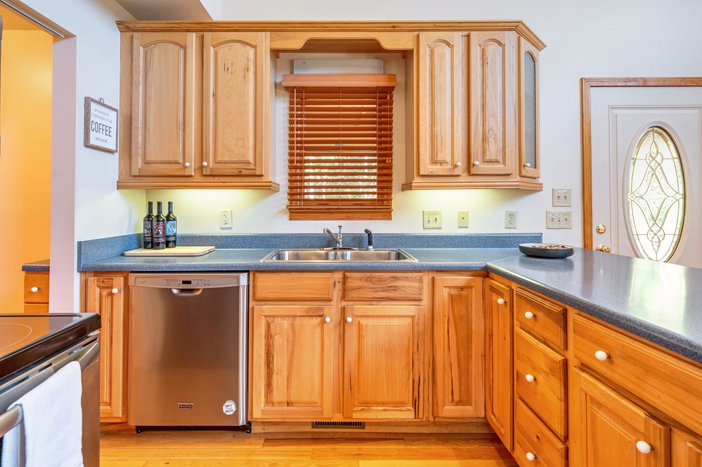 314 Ruby Ridge Young Harris, GA 30582 - Photo 8 of 39 a kitchen with stainless steel appliances granite countertop a refrigerator and a sink