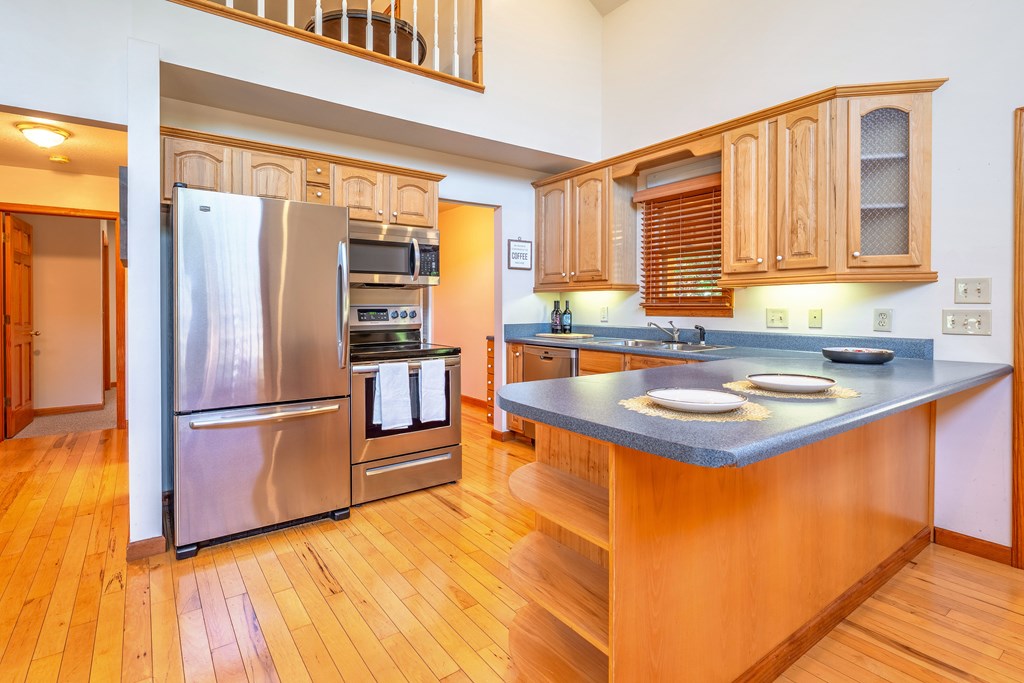 314 Ruby Ridge Young Harris, GA 30582 - Photo 9 of 39 a kitchen with stainless steel appliances granite countertop a refrigerator a sink and a stove