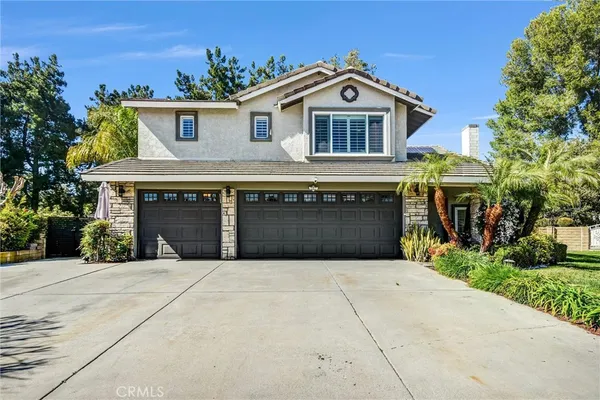 a front view of a house with yard