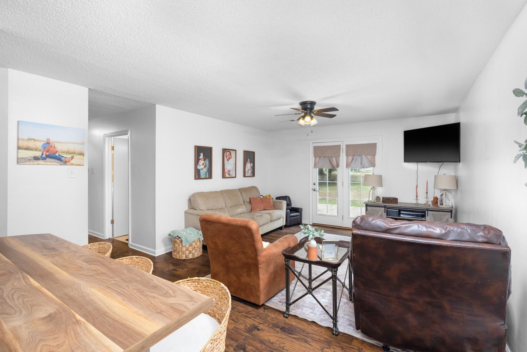 586 Beaver Road Munford, TN 38058 - Photo 5 of 21 Living area featuring wood-finish flooring, white walls, and a ceiling fan