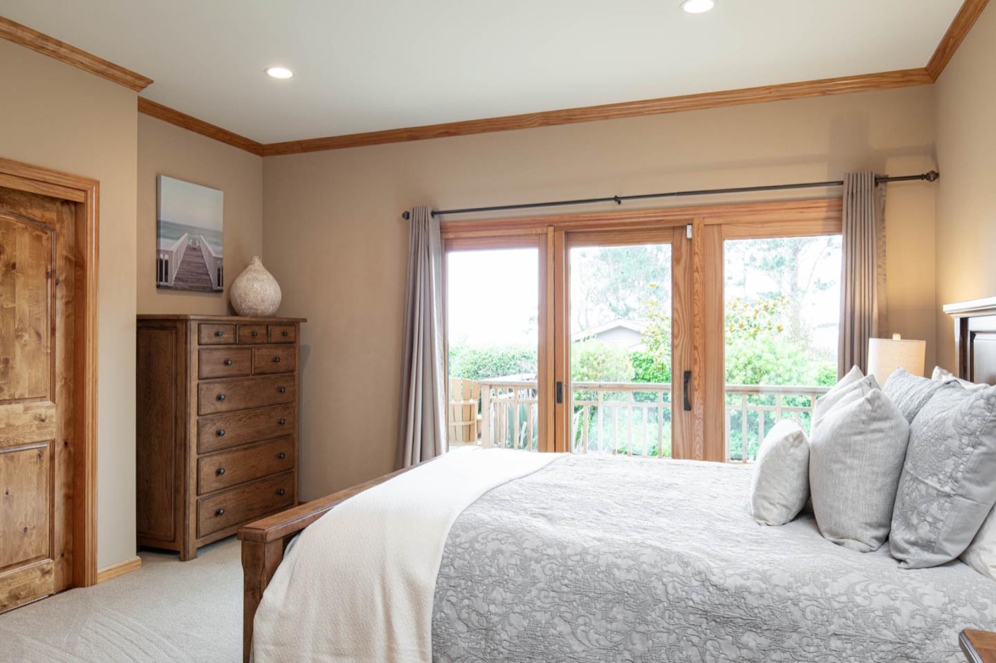 2876 Oak Knoll Road Pebble Beach, CA 93953 - Photo 12 of 14 a bedroom with a bed and a large window