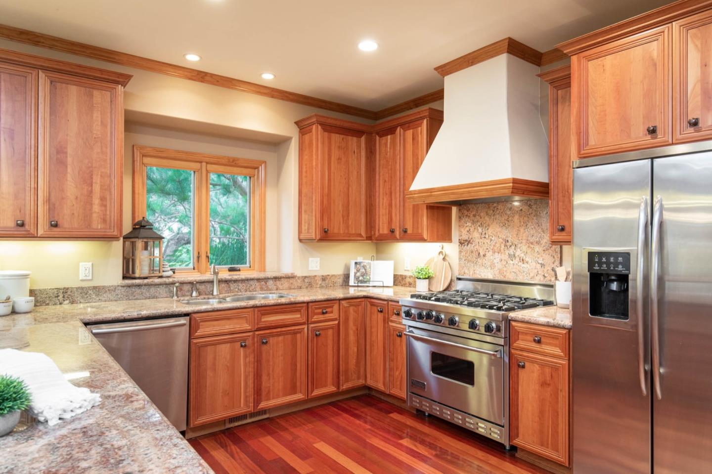 2876 Oak Knoll Road Pebble Beach, CA 93953 - Photo 6 of 14 a kitchen with stainless steel appliances granite countertop a stove a sink dishwasher and a refrigerator
