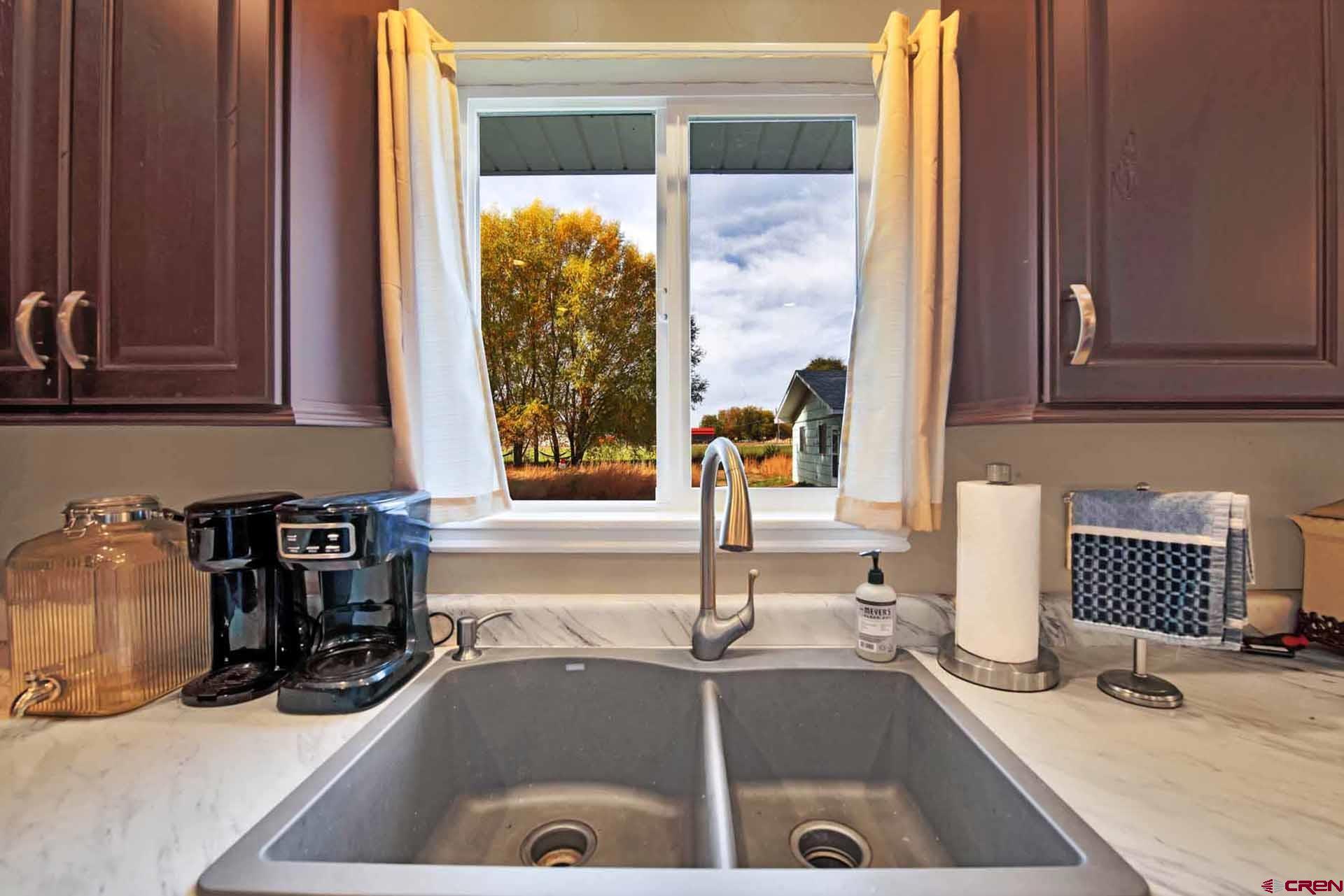 10487 2100th Road Austin, CO 81410 - Photo 14 of 35 a kitchen with a sink and a window