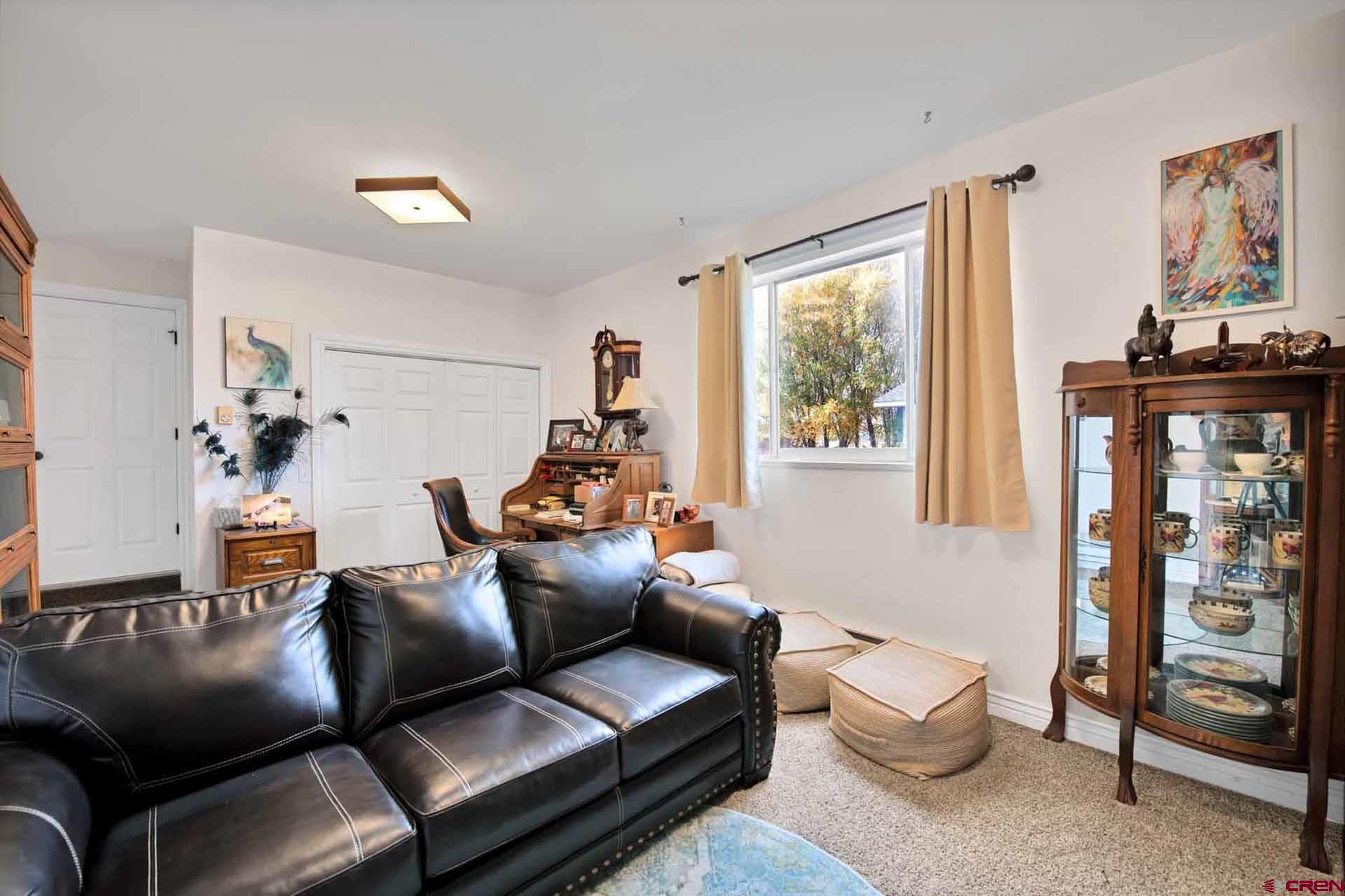 10487 2100th Road Austin, CO 81410 - Photo 18 of 35 a living room with furniture and a window