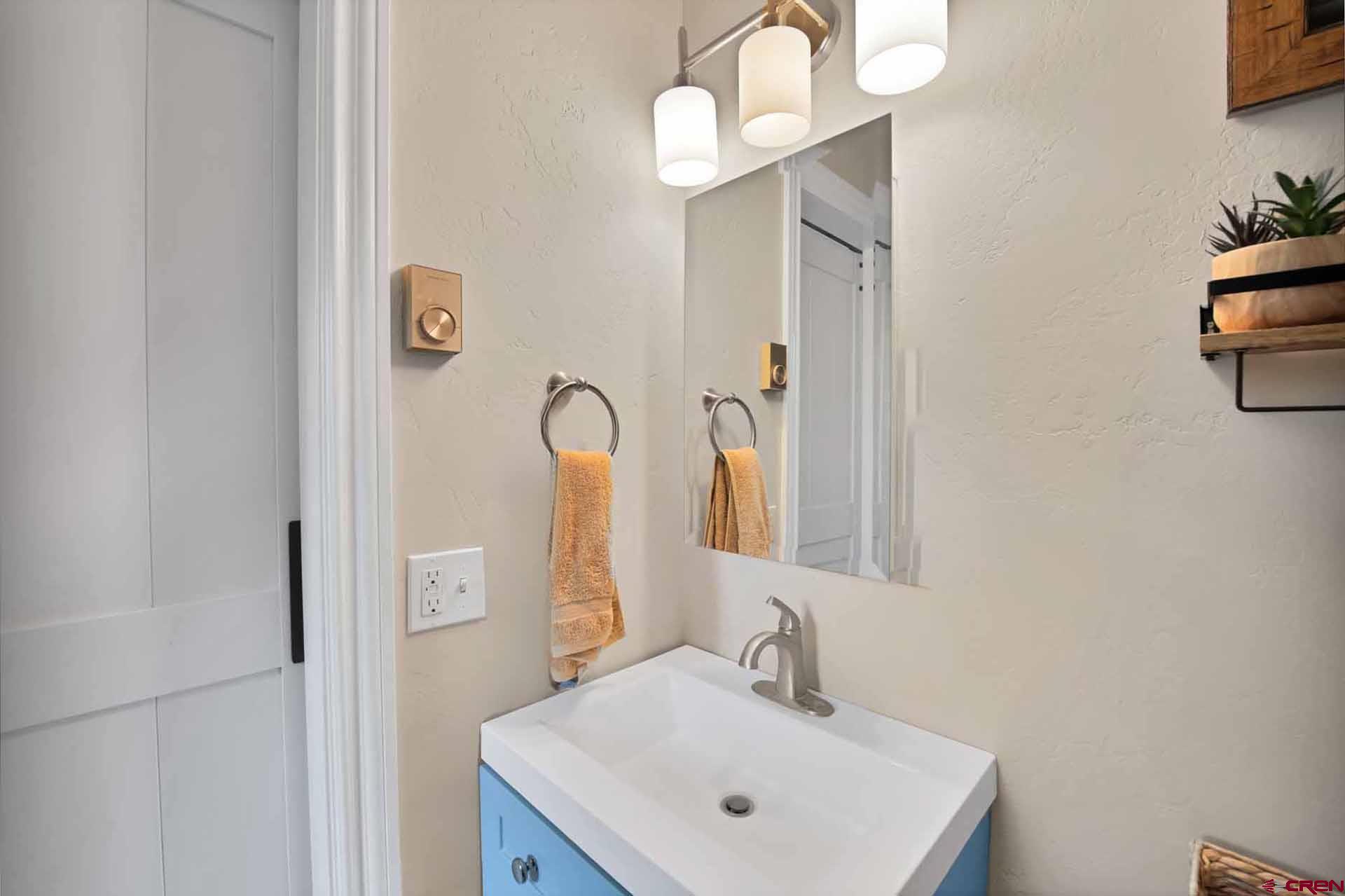 10487 2100th Road Austin, CO 81410 - Photo 24 of 35 a bathroom with a sink and a mirror