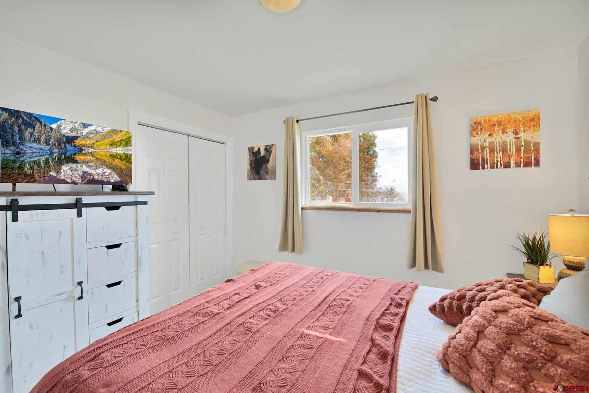 10487 2100th Road Austin, CO 81410 - Photo 26 of 35 a bedroom with a bed and a window