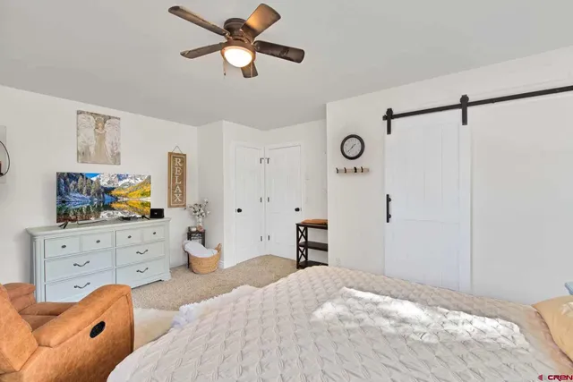 a bedroom with a bed and furniture