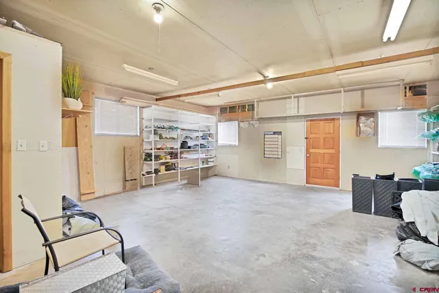 a view of a livingroom with furniture and windows