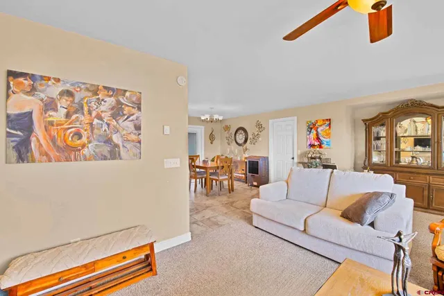 a living room with furniture and next to a window