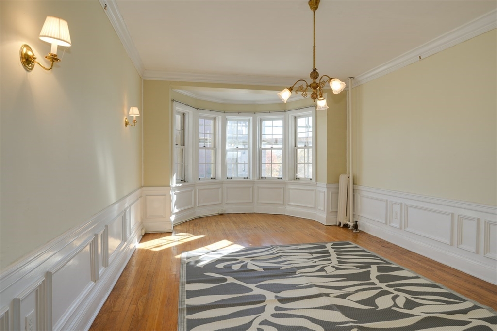 983 Memorial Drive, Unit 502 Cambridge, MA 02138 - Photo 18 of 33 a view of an empty room with window and chandelier fan